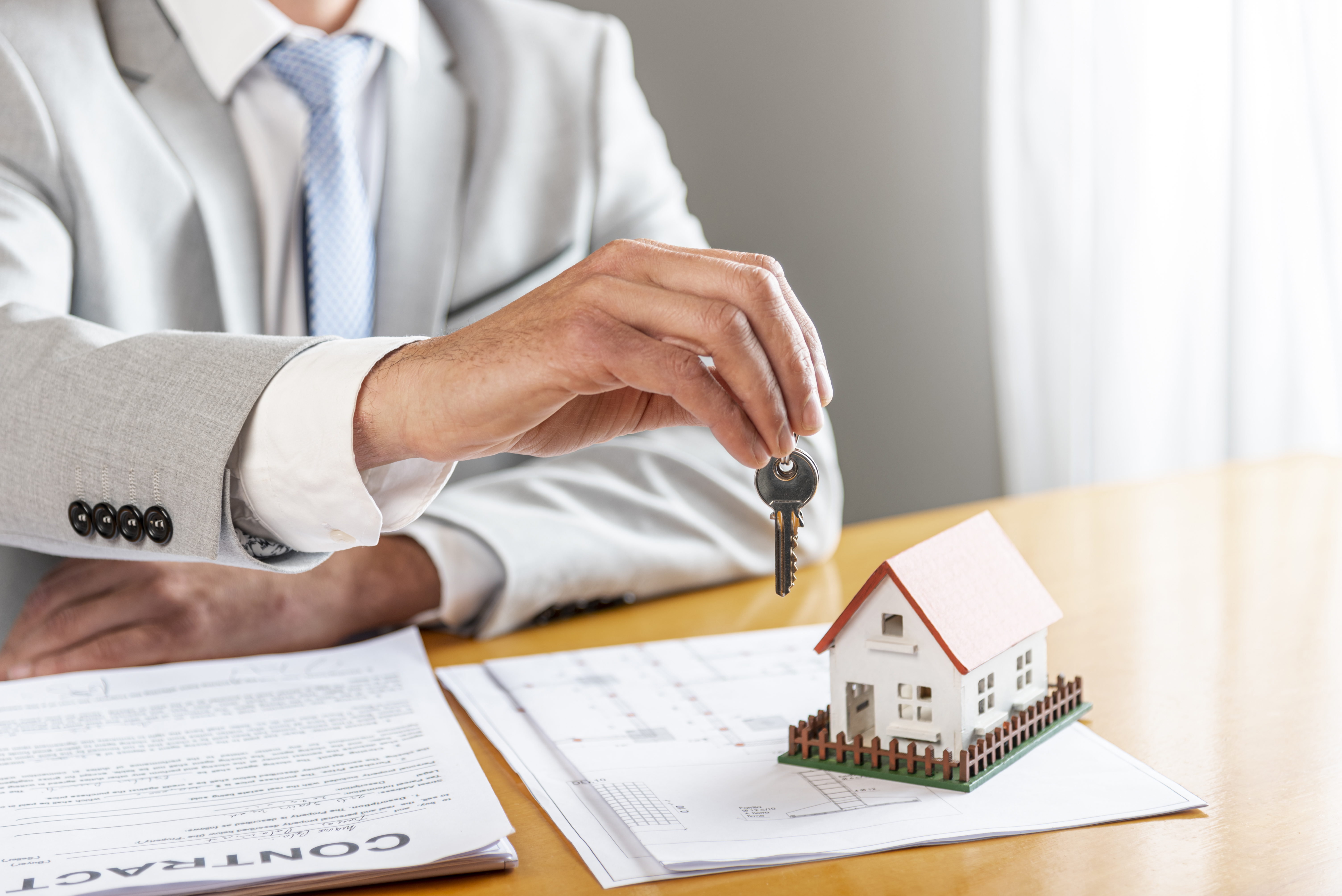 Rental property keys and contract documents used for maintenance planning